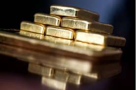 Harga Emas Melemah di Tengah Penguatan Dolar AS dan Sikap Hawkish The Fed