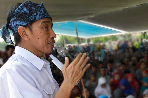 Jokowi Klarifikasi Kekayaan ke KPK dengan Salam Dua Jari