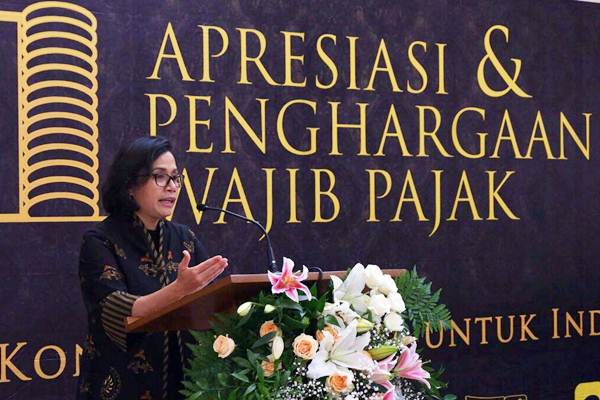 Menteri Keuangan Sri Mulyani memberikan kata sambutan di sela-sela pemberian penghargaan wajib pajak besar di Jakarta, Selasa (13/3/2018). - JIBI/Nurul Hidayat 