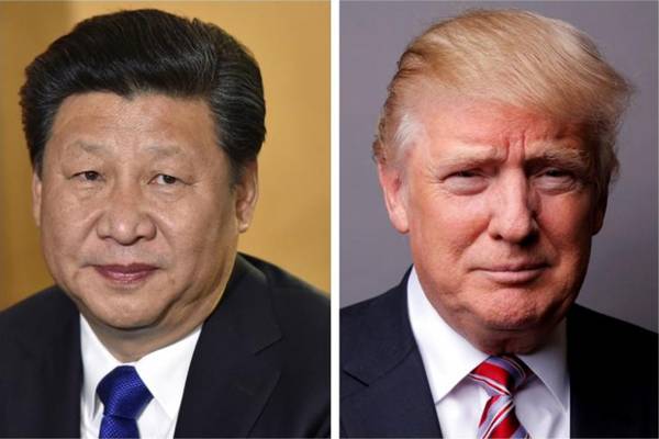 Presiden China Xi Jinping (kiri) dan Presiden AS Donald Trump. - .Reuters/Toby Melville