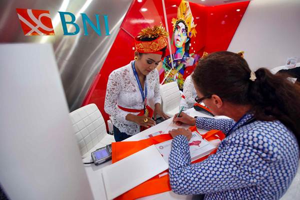 Delegasi melakukan transaksi menggunakan Kartu Virtual Account Debit Bank BNI di sela-sela Pertemuan IMF  World Bank Group 2018, di Nusa Dua, Bali, Jumat (12/10/2018). - JIBI/Abdullah Azzam