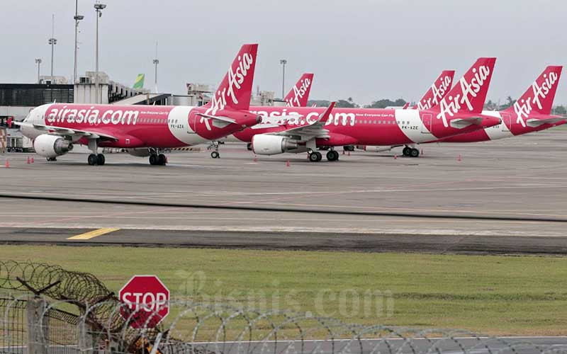 Airasia Bolehkan Penumpang Bawa Dua Tas Masuk Kabin Ekonomi Bisnis Com