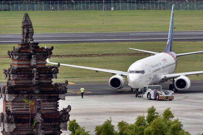 Pesawat Sriwijaya Air, berada di kawasan Bandara Internasional I Gusti Ngurah Rai, Bali, Jumat (8/3/2019). - ANTARA/Fikri Yusuf