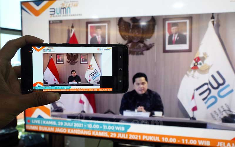 Tampilan layar menampilkan Menteri BUMN Erick Thohir memberikan sambutan saat Pelepasan Jelajah BUMN 2021 BUKANJAGOKANDANG di Jakarta, Kamis (29/7/2021).Bisnis - Eusebio Chrysnamurti