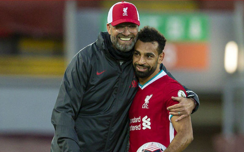 Pelatih Liverpool Jurgen Klopp dan ujung tombak Mohamed Salah. - LiverpoolFC.com