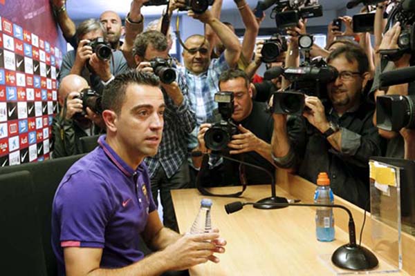 Xavi mengumumkan pengunduran dirinya dari FC Barcelona - Reuters/Gustau Nacarino