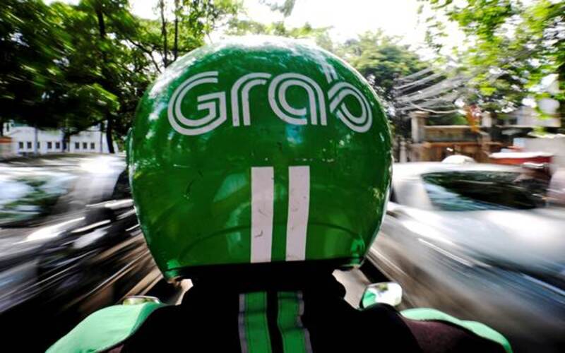 Ilustrasi pengemudi ojek daring Grab. - Reuters/Beawiharta