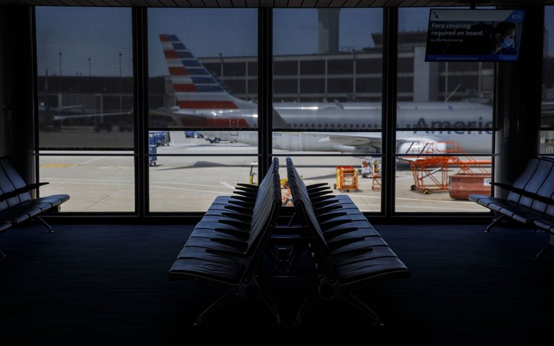 Pesawat milik American Airlines Group Inc. diparkir di bandara O'Hare International Airport (ORD) di Chicago, Illinois, AS -  Bloomberg / Patrick T. Fallon