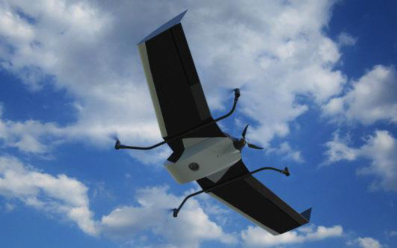 Sebuah drone fixed wing sedang mengudara. Terra Drone