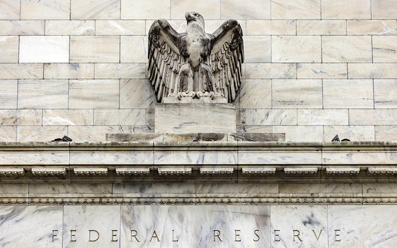 Gedung bank central Amerika Serikat atau The Federal Reserve di Washington, Amerika Serikat, Minggu (19/12/2021). - Bloomberg/Samuel Corum