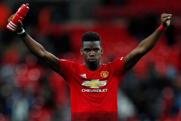 Gelandang serang Manchester United Paul Pogba. - Reuters/Eddie Keogh