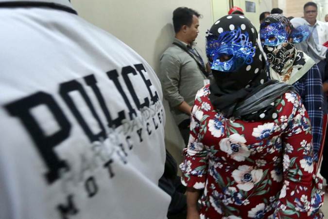 Korban perdagangan orang dihadirkan saat rilis pengungkapan tindak pidana perdagangan orang di Jakarta, Selasa (9/4/2019). - Bisnis/Nurul Hidayat