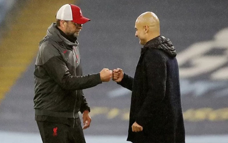 Pep Guardiola (kanan) dan Jurgen Klopp./Antara - Reuters