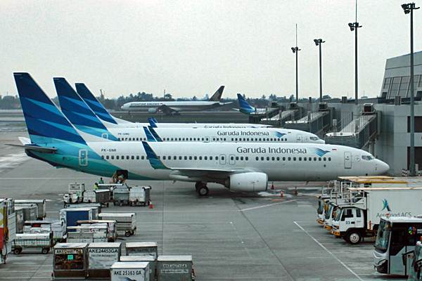 Pesawat Garuda Indonesia berada di terminal 3 Bandara Soekarno-Hatta, Tangerang, Banten, Senin (26/11/2018). - JIBI/Paulus Tandi Bone
