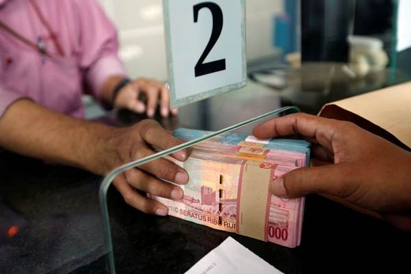 Transkasi penukaran uang rupiah di sebuah money changer di Jakarta, Selasa (4/9/2018). - Reuters/Willy Kurniawan
