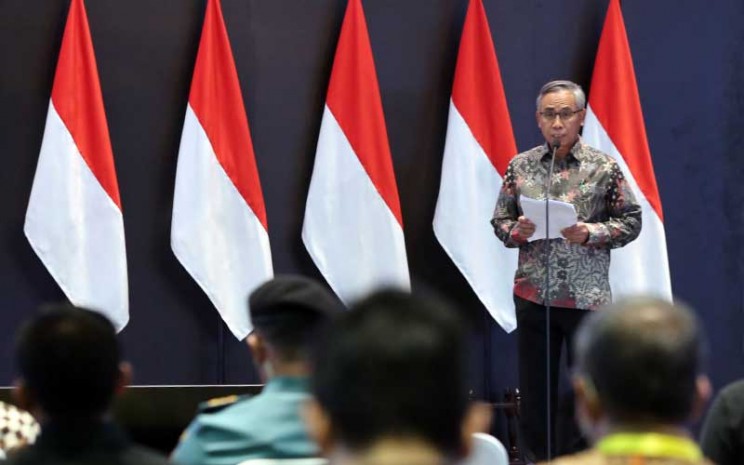 Ketua Dewan Komisioner OJK Wimboh Santoso memberikan sambutan saat pembukaan pembukaan perdagangan Bursa di BEI, Jakarta, Senin (3/1 - 2021). Bisnis