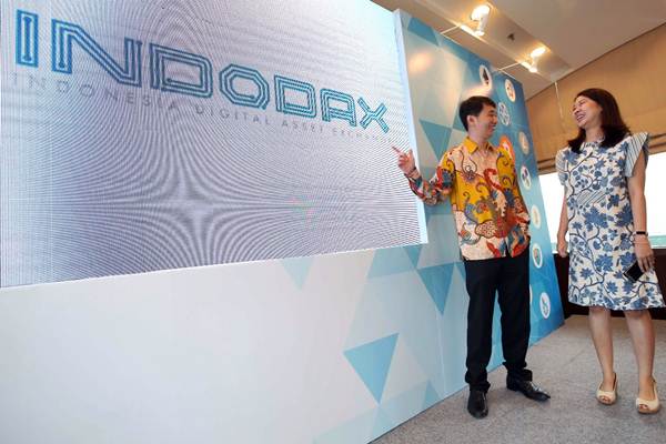 CEO INDODAX Oscar Darmawan (kiri) berbincang dengan COO INDODAX Erdita Purnamasari di sela-sela peluncuran wajah baru Bitcoin Indonesia menjadi INDODAX (Indonesia Digital Asset Exchange) di Jakarta, Rabu (14/3). - JIBI/Abdullah Azzam