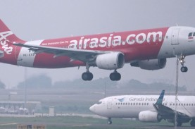 Adu Cepat Garuda Indonesia (GIAA) dan AirAsia (CMPP) Tanggalkan Notasi Khusus